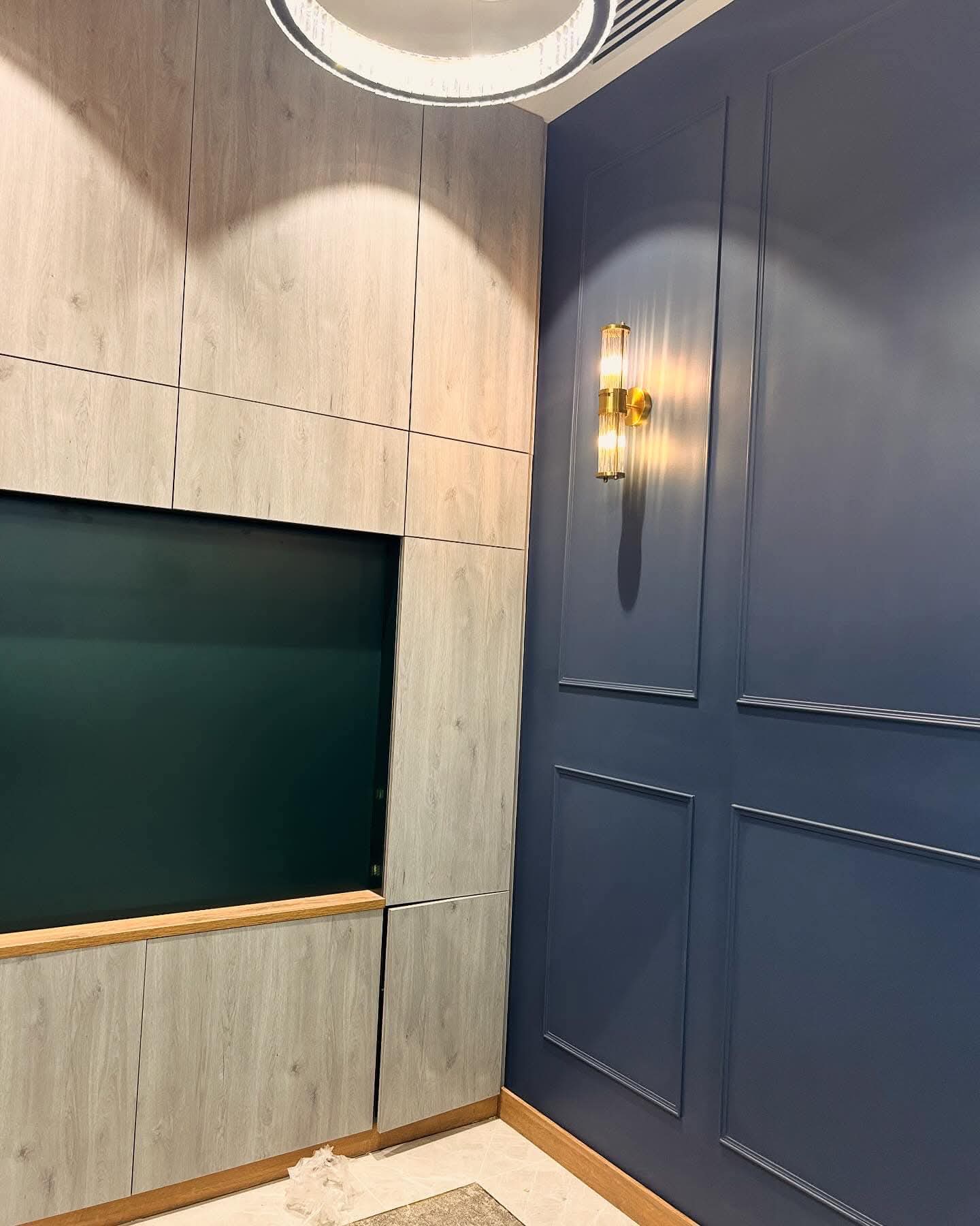 Bespoke navy wall panelling and decorative finish